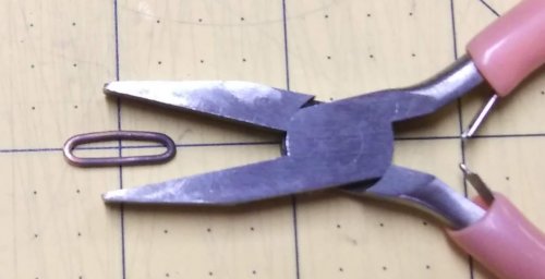 Judy Larson's Simple Bail on a Coin Pendant - , Findings & Components, Toggles & Clasps, Earwire & Headpin, Butane Torch, Soldering, Solder, gently squeezing both ends with flat nose pliers.    